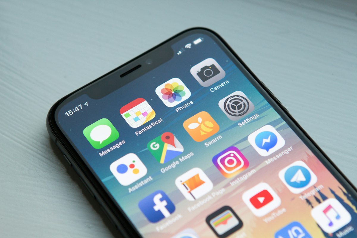 Android phone showing a React Native app beside Kotlin native tooling